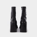 Vinyl Ac Ankle Boots in Black