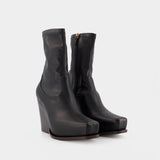 Cowboy Boots in Black Synthetic Leather