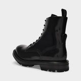 Laced Boots in Black Patent Leather