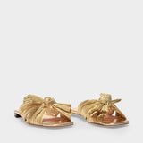 Daphne Knot Flat Sandals in Gold Fabric